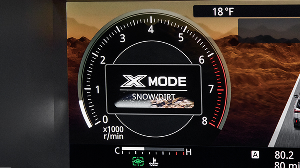 The X-MODE traction control settings in the digital dashboard display of a Subaru vehicle