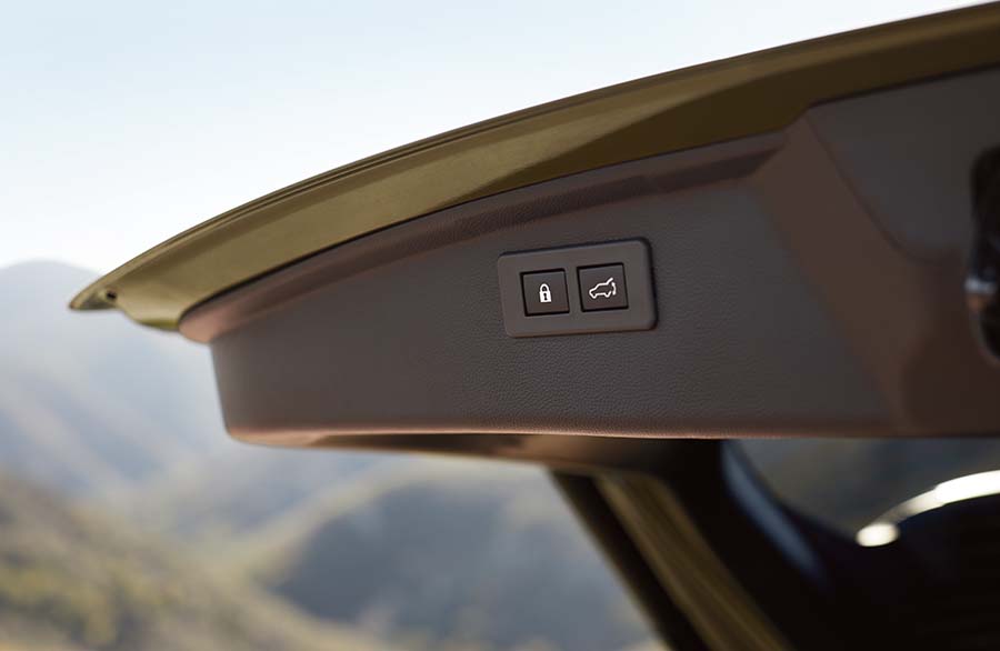 A Subaru Outback with rear gate open.