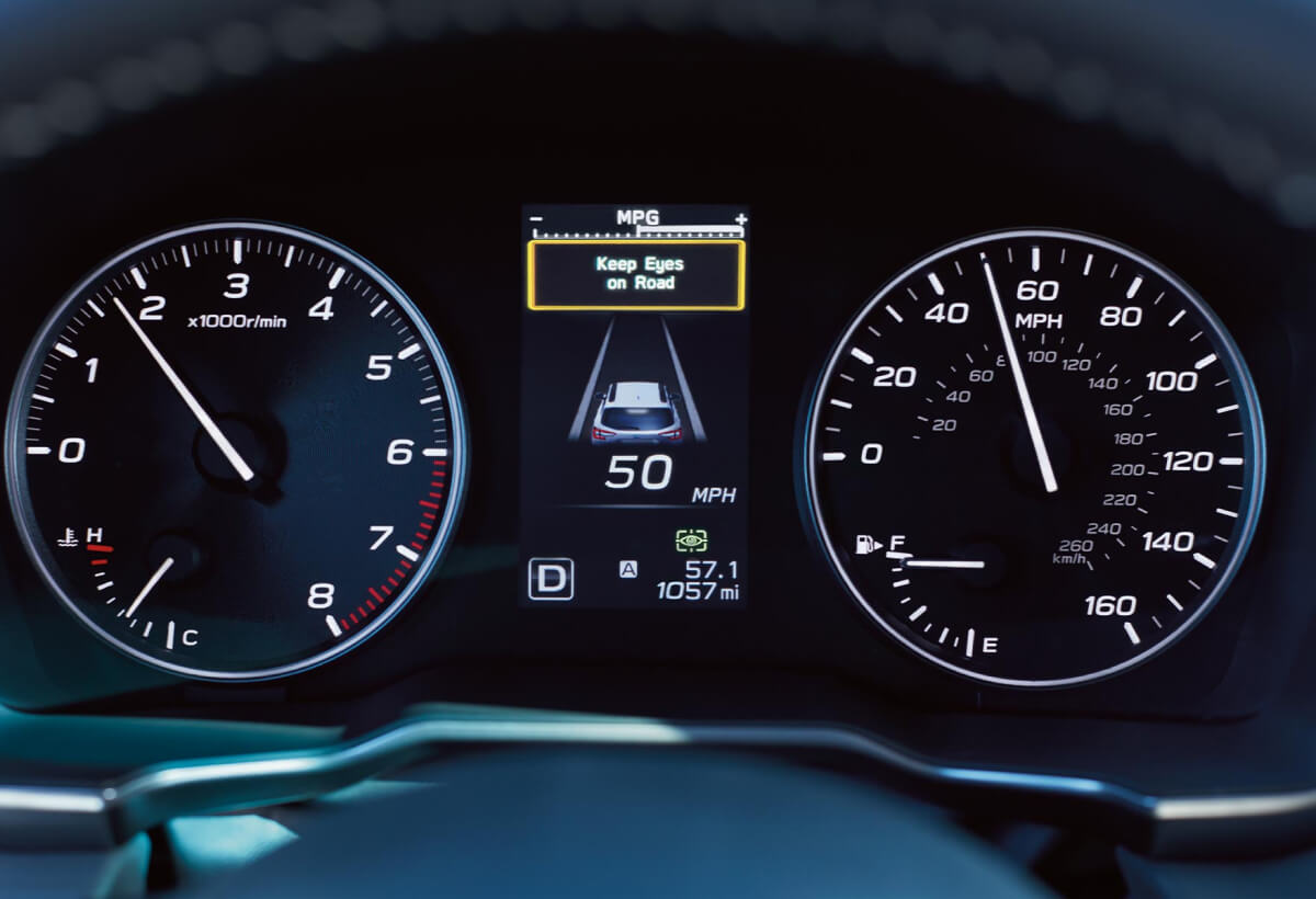 A close-up of a warning message on the dashboard display from the DriverFocus Distraction Mitigation System available on the 2022 Subaru Outback.