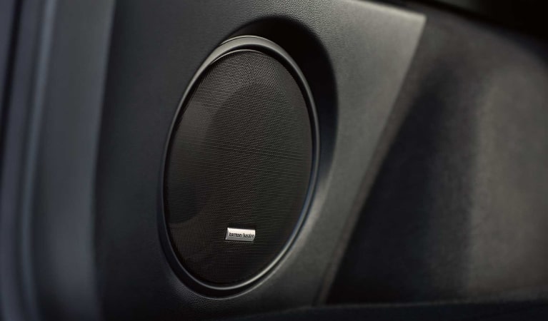 A close-up of one of the speakers in the Harman Kardon premium audio system available on the 2022 Subaru Outback.