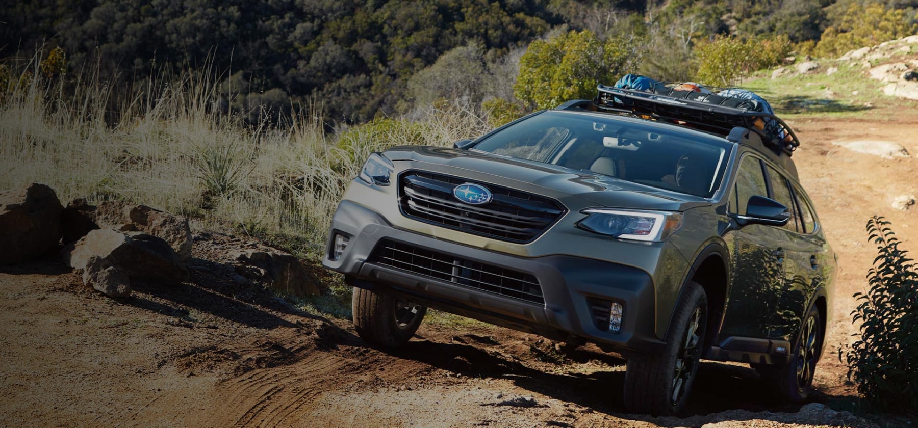 A 2022 Subaru Onyx Edition XT climbing a steep dirt road.