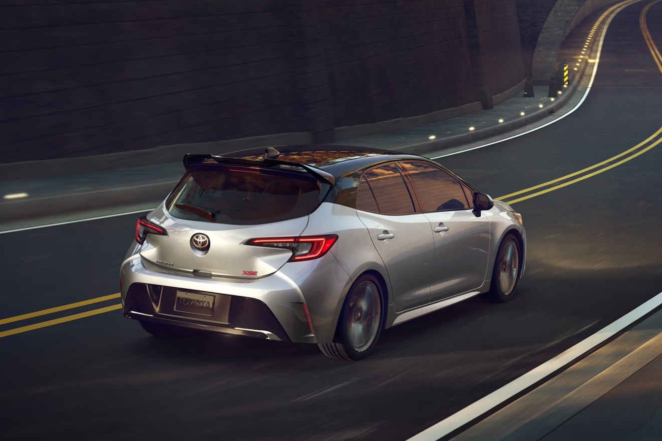 2027 Toyota Corolla Hatchback driving on a 2 lane street