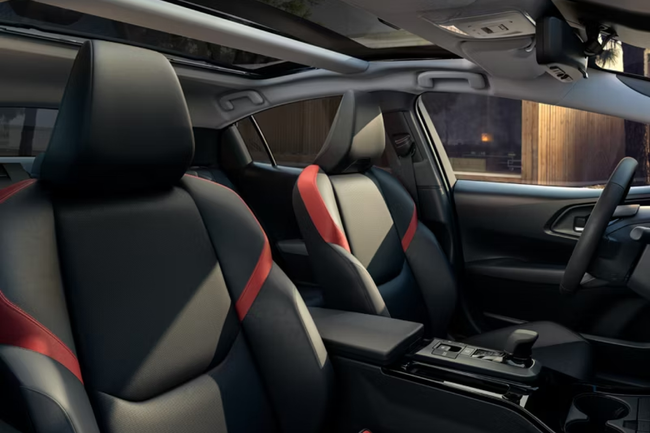 Close up of interior showing black and red front seats