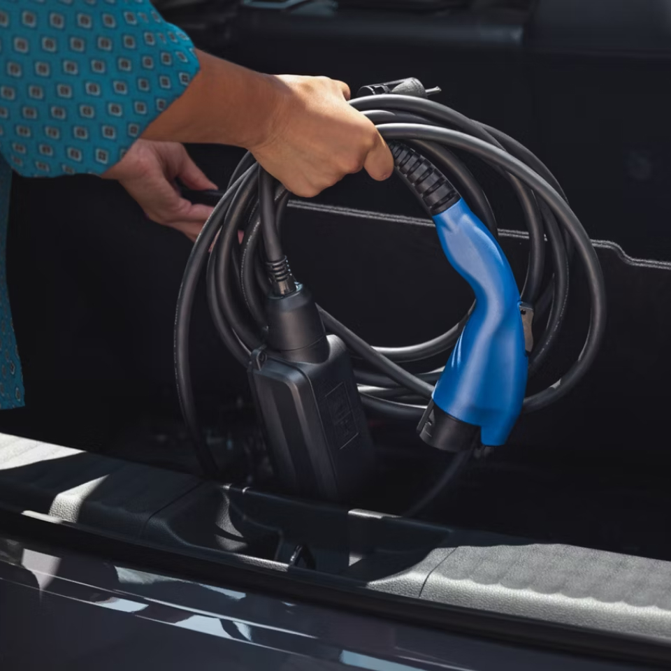 Close up of hands putting charging equipment in storage