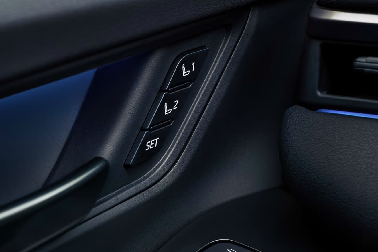 Driver's seat memory setting buttons on the door panel of the 2027 Toyota bZ Woodland