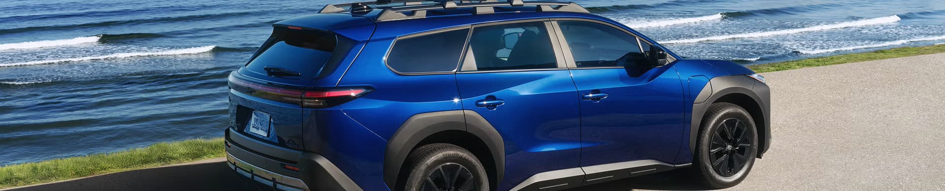 Side view of a blue 2027 Toyota bZ Woodland