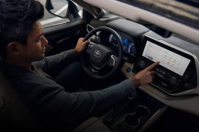 Person using dashboard touch screen