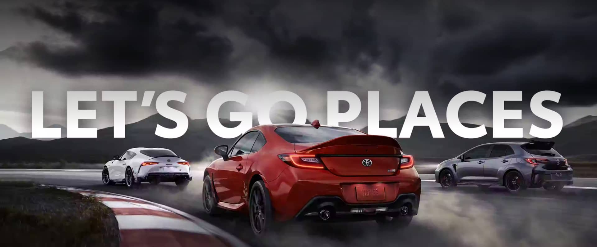3 Toyota vehicles with the text "Let's Go Places" on top