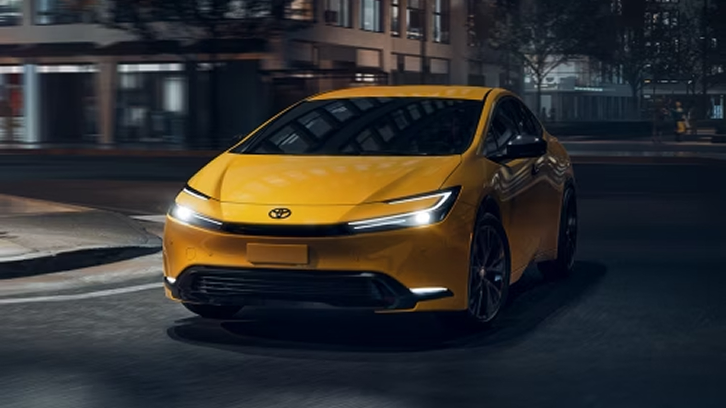 Toyota Prius driving through city at night