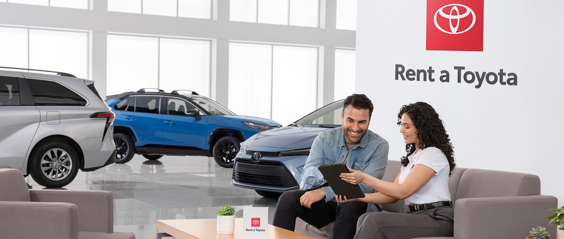 Customer in a showroom renting a Toytoa