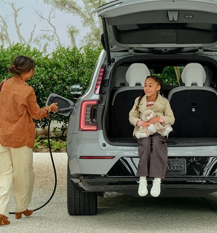 Owner charging a Volvo SUV at home