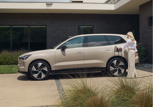 Volvo SUV plugged into a home charger