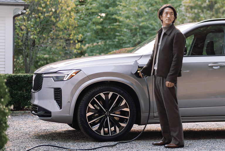 Volvo charging in a suburban driveway