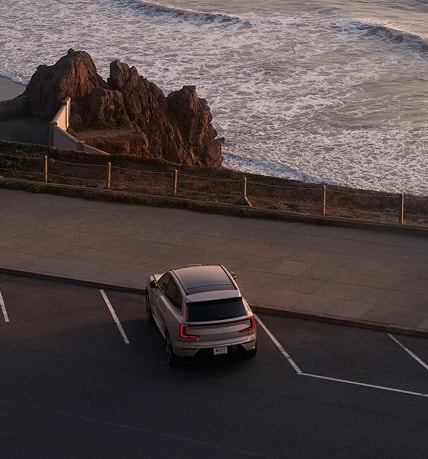 Volvo SUV parked near the shore