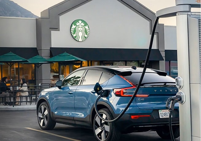Volvo C40 Recharge charging in a Starbucks parking lot